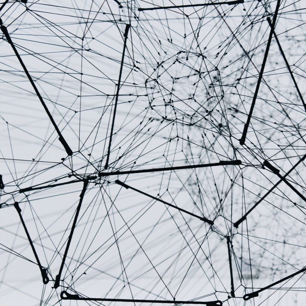 Image of a structure covered in wires, making a synthetic helioscenic net of dreams and ambition.